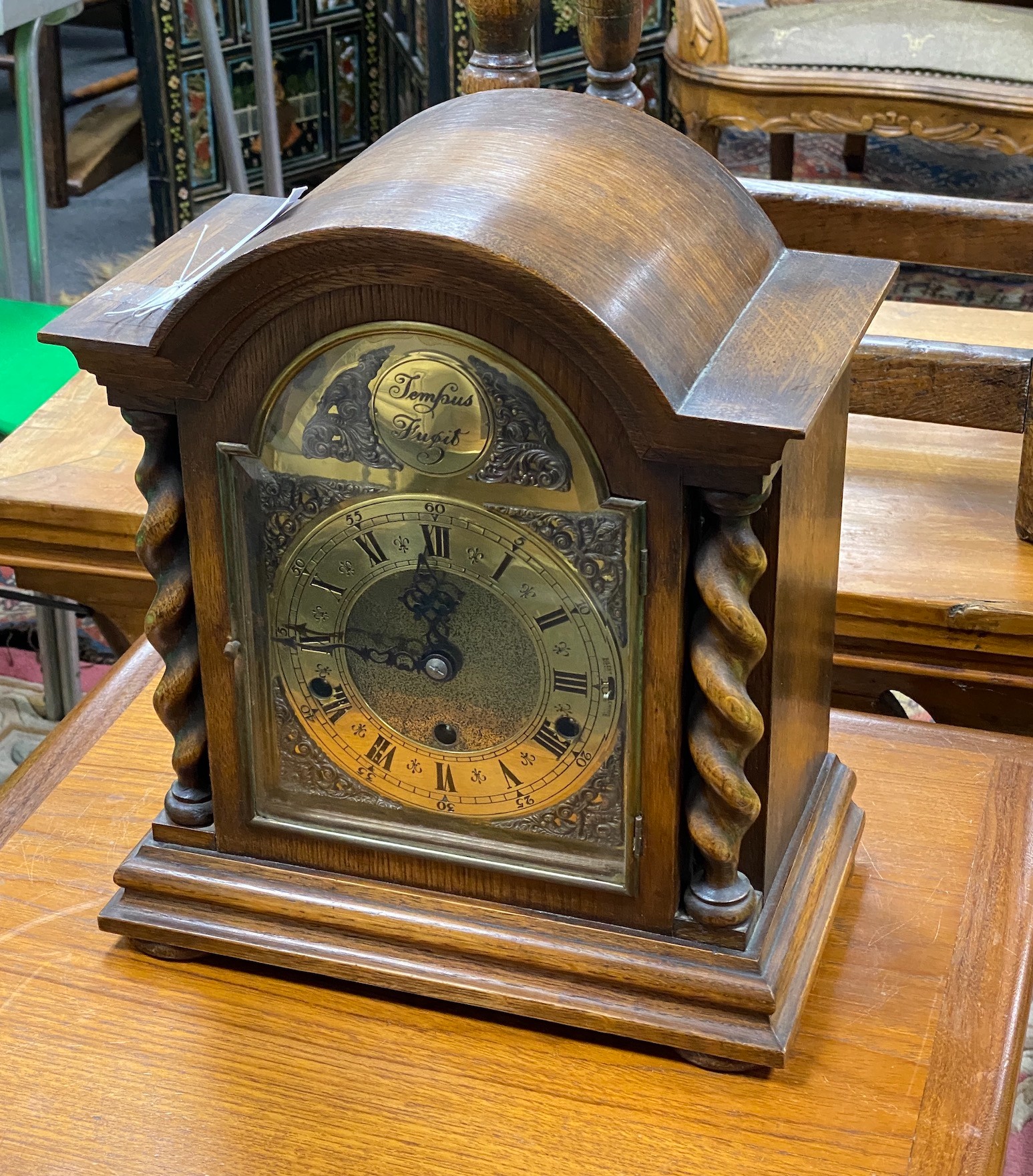 An early 20th century oak 8 day mantel clock, width 30cm, height 35cm